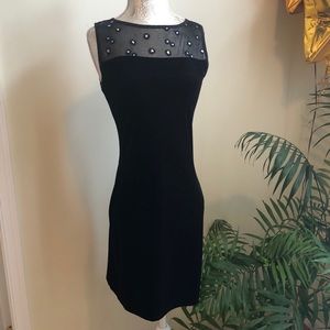 Black mini velvet dress with sequins on top.